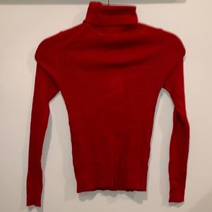 A bright red, long sleeve, turtle neck!
